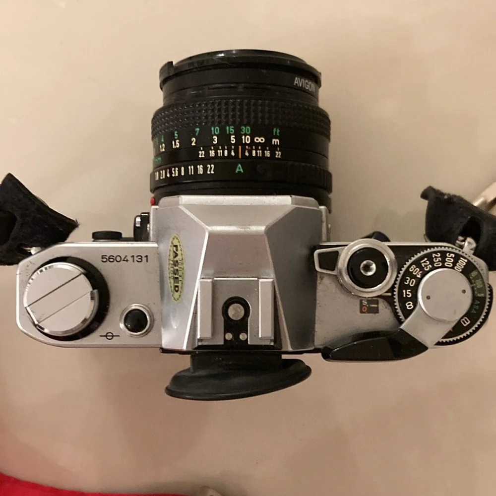 Vintage Canon Camera with additional lenses.